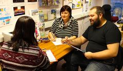 Kathleen Williamson (centre) and Neil Pearson with a client at the Market House offices of VAS Volunteering - Photo: Louise Thomason