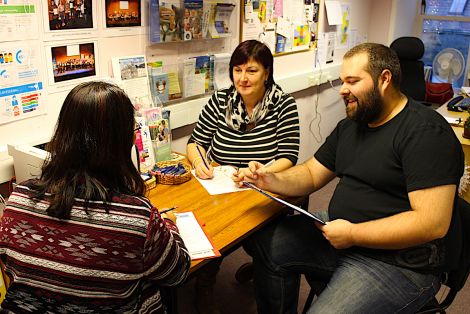 Kathleen Williamson (centre) and Neil Pearson with a client at the Market House offices of VAS Volunteering - Photo: Louise Thomason