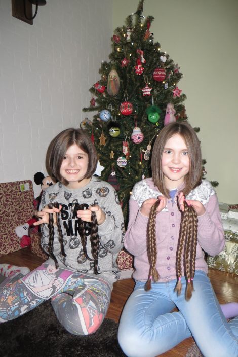 A new look just in time for Christmas: Faye Anderson and Lori Sutherland displaying their chopped-off locks.