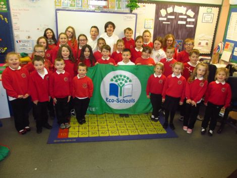 Pupils at Cullivoe Primary School celebrate achieving their third eco flag. Photo courtesy of Shetland Islands Council.