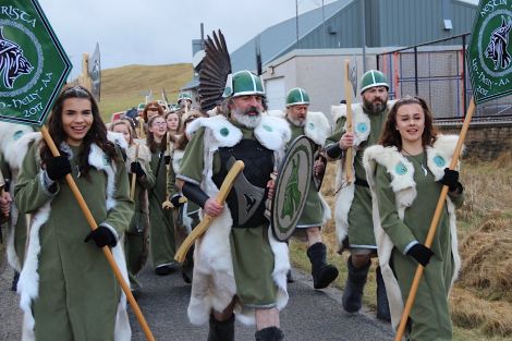 Nesting & Girlsta Guizer Jarl Norman Johnston flanked by his standard bearers Leyna Johnston (left) and Karis Johnston.