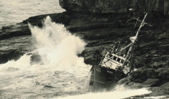 The trawler Juniper jammed against the rocks below 200 feet high cliffs at Papa Stour in 1967 - Photo: Dennis Coutts