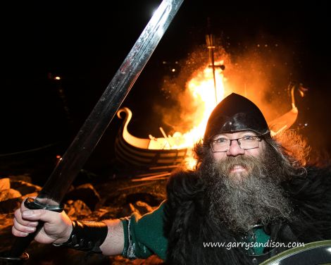 Cullivoe Up Helly Aa guizer jarl Mark Lawson thoroughly enjoying himself at the burning on Friday night - Photo: Garry Sandison