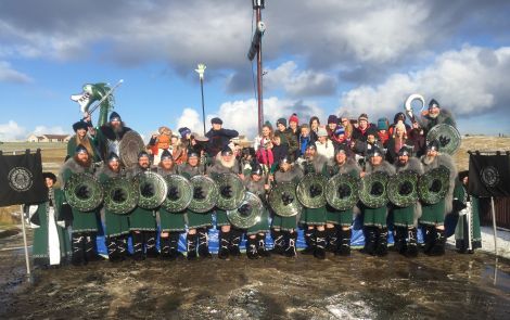 The Cullivoe jarl's squad and the bairns from the local primary school come together for a group photo - Photo: Garry Sandison