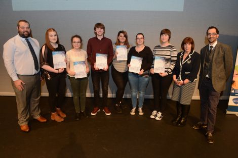 Youth volunteering development worker Neil Pearson (left), Voluntary Action Shetland executive officer Catherine Hughson (second from right) and Shetland Times editor Adam Civico (right) with the recipients of the summit awards (left to right): Imogen Teale, Rachel Keay, Thomas Hawick, Holly Cole, Mariel Leask, and Catriona Gilbertson - Photo:Dave Donaldson