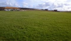 The pitch at Strom. Ross Smith of Injury Shetland has started a fundraising campaign to pay for a defibrillator. Photo: Shetland News.