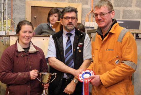 Jamie Halcrow (right) is presented with the Bryden Budge memorial cup by Kirsty Budge and Stephen Leask of event sponsors Harbro.