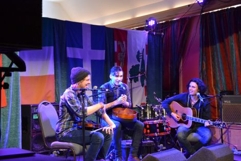 Prince Edward Island trio Ten Strings and a Goatskin telling one of several humorous anecdotes at Islesburgh on Friday afternoon. Photo: Shetland News