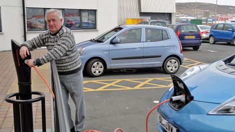 Jim Dickson recharging his Nissan Leaf in Lerwick, in March 2013. Photo: Hans J Marter/ Shetland News