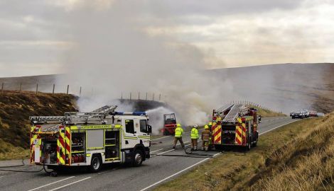 Traffic had to wait until fire fighters managed to extinguish the blaze. Photo: Ronnie Robertson