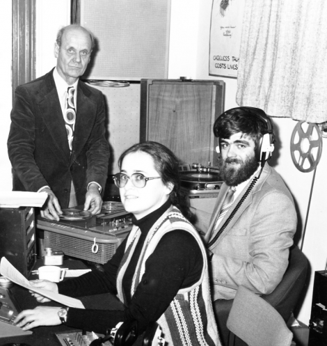 Suzanne Gibbs and Jonathan Wills broadcasting from the Brentham House studio. BBC engineer Cecil Watkinson (left) came out of retirement to give technical support to the new radio station. Photo: Jonathan Wills collection