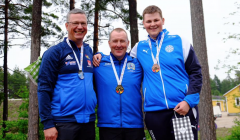 John Magnus Laurenson (centre) with his shooting peers after winning gold in the Olympic skeet individual event. Photo: Shetland Island Games Association