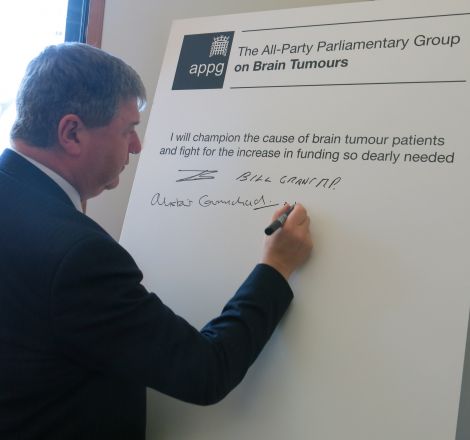 MP Alistair Carmichael signing the brain tumour pledge earlier this week.