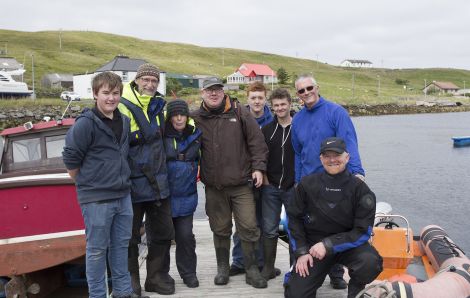 The team that successfully herded the pilot whale out of Vidlin Voe (left to right): James Johnson, Pete and Jan Bevington of Hillswick Wildlife Sanctuary, Hugh Harrop of Shetland Wildlife, Paul Hunter, Sam Nicolson, Ian White and Ryan Leith - Photo: Tim Stenton/Shetland Wildlife