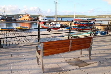 The bench overlooking Lerwick's small boat harbour, installed as a memorial for late lifeboat volunteer Ian Leask. Photo: Davie Gardner.