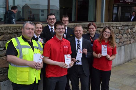 Loganair managing director Jonathan Hinkles (third from right) was in Shetland on Monday in an attempt to counter Flybe's PR offensive as the airlines prepare to go head-to-head from September. Photo: BBC Radio Shetland.