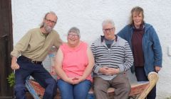 Jan and Pete Bevington with their neighbours Anne and Iain Sloan (centre) who made the 500th pledge to support Hillswick Wildlife Sanctuary.