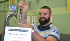 Lerwick Brewery's Jon Pulley pulling pints at the beer festival. Photo: BBC Radio Shetland