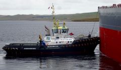 The tug in action on Tuesday as it helped berth the Antonis tanker at Sullom Voe. Photo: John Bateson