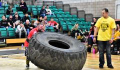 Shetland's new strongest man Jonni Manson in action during the tyre flip event. Photo: Mark Berry