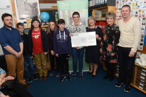 The winning team being handed a cheque from YPI. L-R: Kris Johnson, Luke Dutch, Alex Jamieson, Zoe Rivett, Kamran Irvani, Dougie Smith, Moira Bell, Helen Budgen, and Andy Paterson. Photo: Dave Donaldson