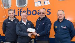 NorthLink's freight manager Kris Bevan and managing director Stuart Garrett with Aith lifeboat's Hylton Henry and RNLI Kirkwall's Graham Campbell.