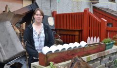 Helen Tait outside her Sandveien home, which was ravaged by fire at the weekend. Photo: Shetland News/Neil Riddell.