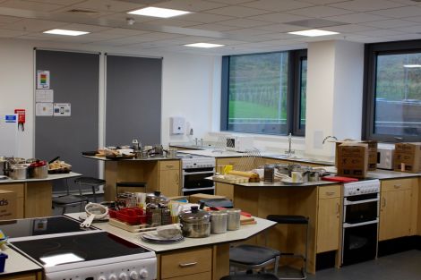 There are three kitchen spaces in the new school for teaching.