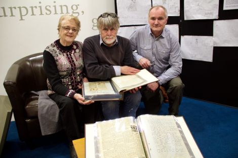 Looking through the minutes are (left to right): former Althing chairwoman Florence Grains, Shetland archivist Brian Smith and current Althing chairman Andrew Halcrow. Photo: Hans J Marter/Shetland News