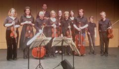 The Edinburgh Quartet (Tijmen Huisingh, violin, at rear; Tom Hankey, violin, far right; Catharine Marwood, viola, 5th from left; Mark Bailey, cello, 3rd from left) with members of Shetland Community Orchestra, after their stunning performance at Mareel. Photo: James Mackenzie