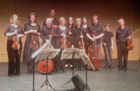 The Edinburgh Quartet (Tijmen Huisingh, violin, at rear; Tom Hankey, violin, far right; Catharine Marwood, viola, 5th from left; Mark Bailey, cello, 3rd from left) with members of Shetland Community Orchestra, after their stunning performance at Mareel. Photo: James Mackenzie