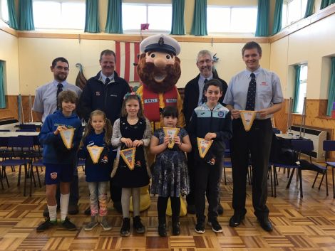 Pictured alongside lifeboat crew Darren Harcus, Gareth Geddes, Stormy Stan, Peter Kerr and Iain Derbyshire are children, from left to right: Torquil Mackenzie (P7), Julia Strachanowska (P4), Lois Tait (P5), Lily Heder (P2), Luke Hackett (P6). Missing from the photo are Zack Arthur (P3) and Isabelle Moss (P7).