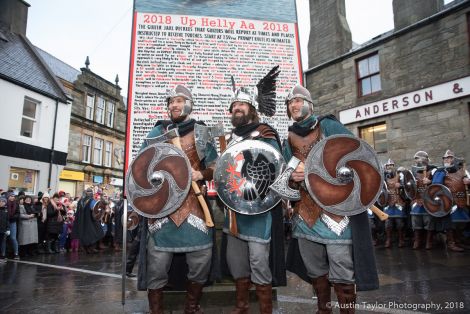 Guizer jarl Stewart Jamieson with his two sons Shane and Haydn in from of the Bill at Lerwick's Market Cross.