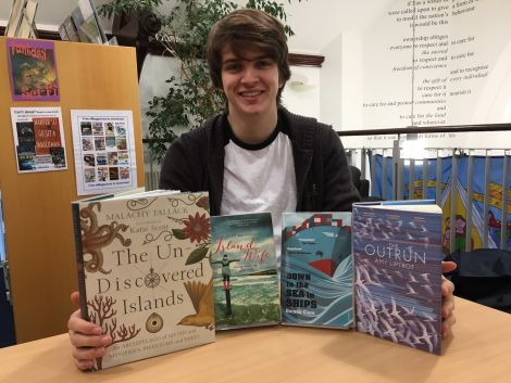 Library assistant Josh Smith with some of the most popular non-fiction books of the year.