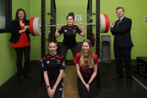 Scottish sports minister Aileen Campbell (left) was in Shetland earlier this month to launch the scheme. She is pictured here with council convener Malcolm Bell and members of the Lerwick Swim Team Adam Miller, Lauren Sandison and Kayla Manson. Photo: SIC