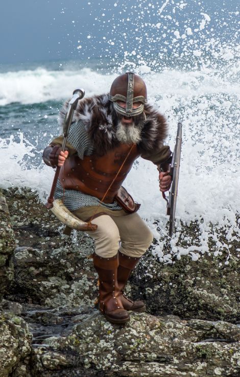 Warrior. The sea crashes behind a viking from Up Helly Aa 2017.