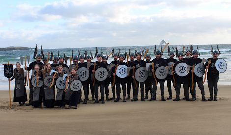 Guizer jarl Aaron Priest with his squad of 20 Vikings and five girls at Norwick beach earlier on Saturday. Photo: Desley Ritch