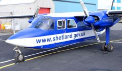 An islander aircraft in front of the hangar at Tingwall Airport. Photo: SIC