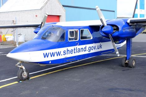 An islander aircraft in front of the hangar at Tingwall Airport. Photo: SIC