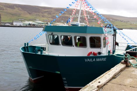 The Vaila Marie sporting Canadian flags in honour of Cooke Aquaculture's roots. Photos: Chris Cope/Shetland News