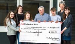 Chairman of the Callum Younger Reach Fund, Malcolm Younger, hands out funds to (left to right): Lulu Johnson, Tabitha Johnson, Ashleigh Jarmson, Ronan Grant, Emily Briggs’ dad Kevin and Hermione Boyes. Photo: Andrew Gibson