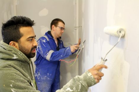 Borges and Adam getting to work in the kitchen area.