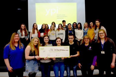 Left to right: Laura Russell (Shetland Befriending Scheme), S3 pupils Leah Johnson, Jayden Grant, Abby Sandison and Igor Gazda, Mairi Jamieson (Shetland Befriending Scheme), Cheryl Cluness, English teacher. Back row: YPI finalists from all S3 classes. Photo: SIC