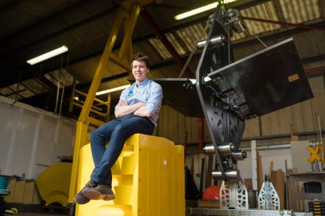 Aqua Power Technologies' Sam Etherington alongside a MANTA converter.