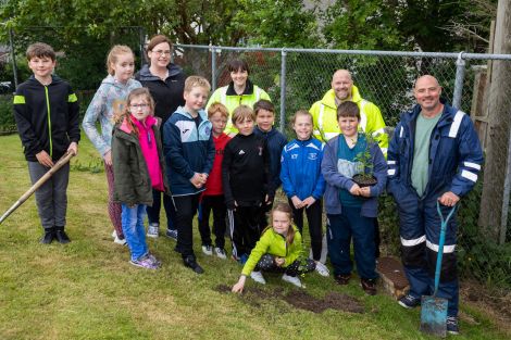 From back left to right: Bell's Brae eco committee teacher Sophie Thouless, Lerwick Port Authority HSEQ assistant Amy Inkster and Stuart Wadley, Shetland Amenity Trust woodlands foreman Paul Goddard with Bell's Brae P2-P7 school pupils. Photo: John Coutts