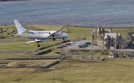 A Flybe plane operated by Loganair flying into Sumburgh. Photo: John Moncrieff