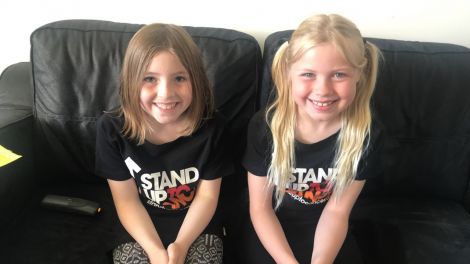 Proud as punch: A beaming Leah (left) and Missy (right) after their bake sale.