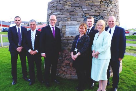 John Swinney (third from left) with (L-R) Trevor Smith and James Armitage, from the AHS project team, head teacher Valerie Nicolson, council convener Malcolm Bell, children's services director Helen Budge and George Smith, chairman of the SIC's education and families committee. Photo: SIC