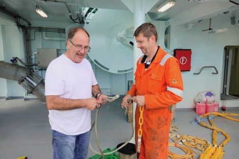 Mate Tommy Eunson and Stuart Anderson rigging gear.