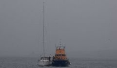 Yacht being towed